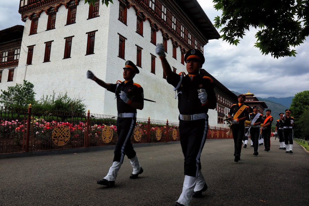Image of soldiers marching towards Flag Down Ceremony inside Tashichho Dzong