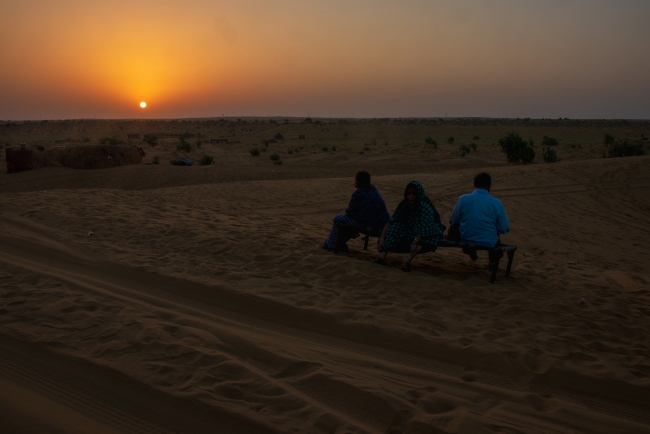 Enjoying the sunrise in Thar Desert sitting on a charpoy